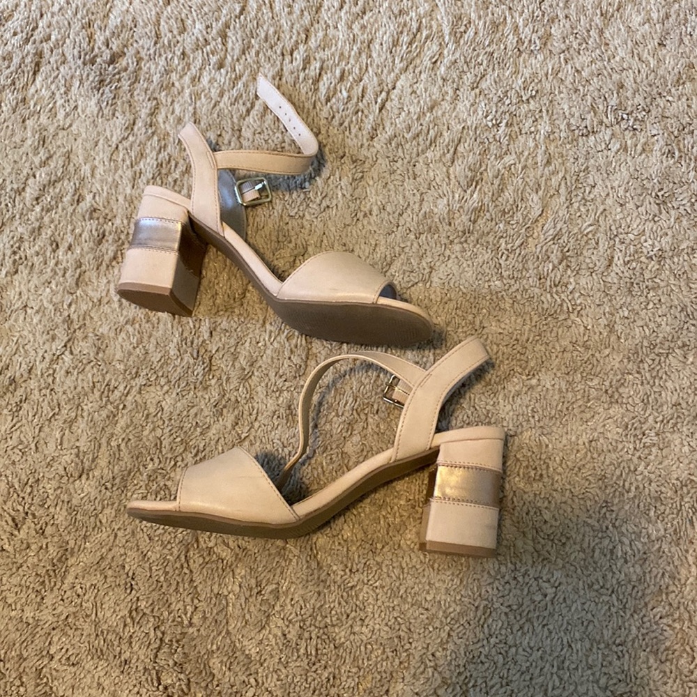 Lightly worn chunky heels.